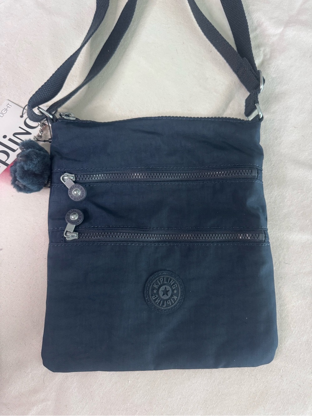 Kipling Black Compact Crossbody Bag with Pom Pom Charm